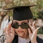 a woman wearing a graduation cap and gown